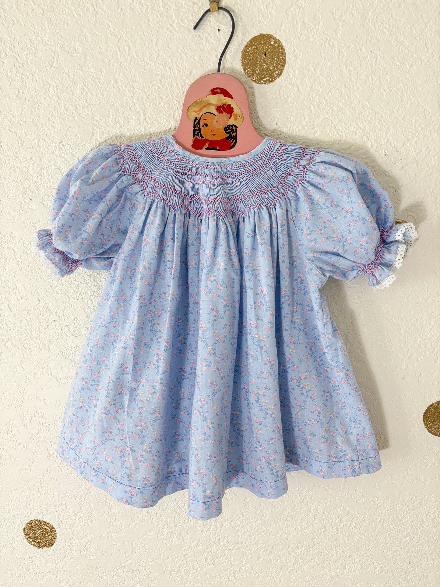 Homemade vintage smocked dainty floral baby dress.