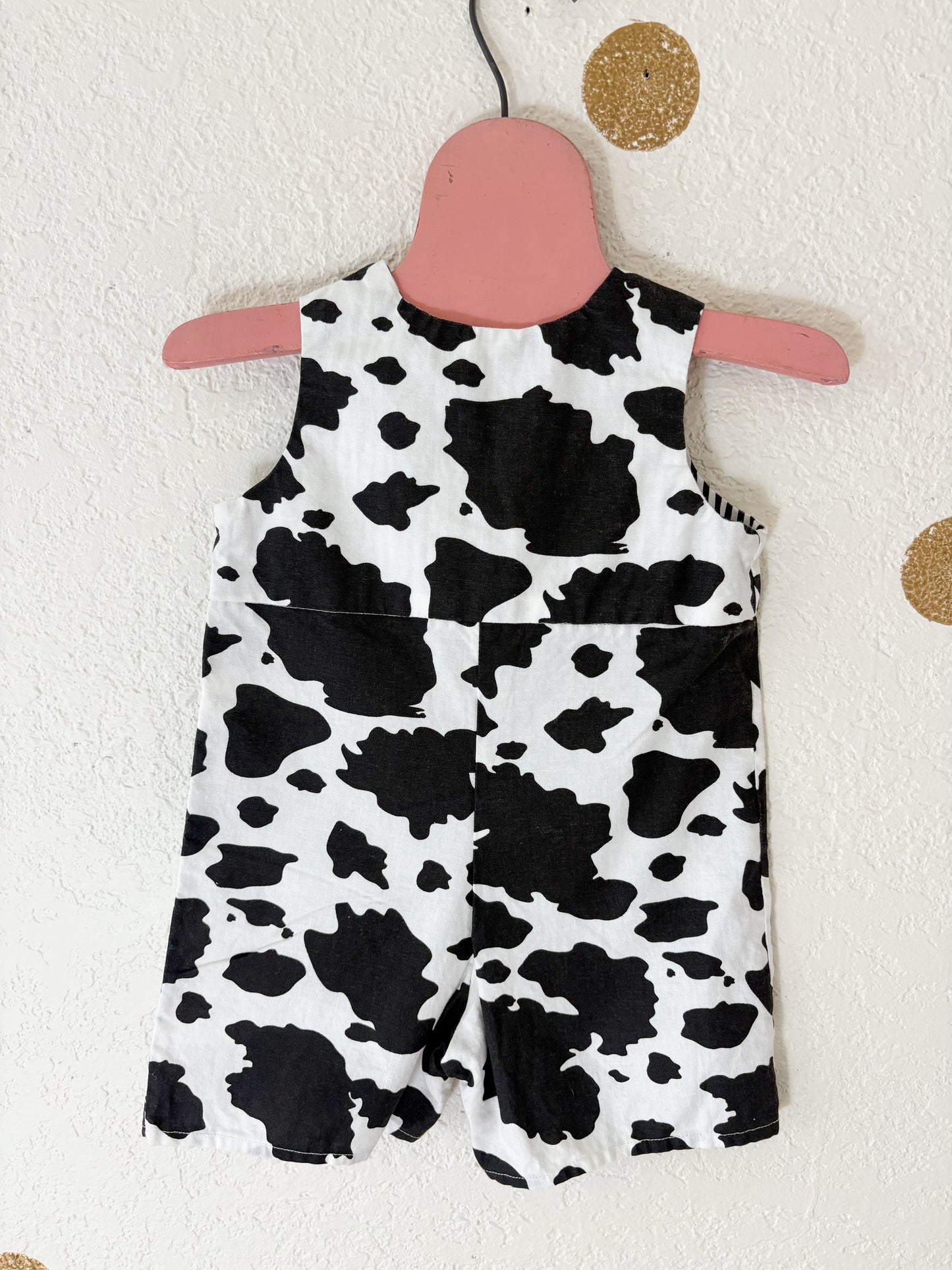 Homemade cow baby romper.