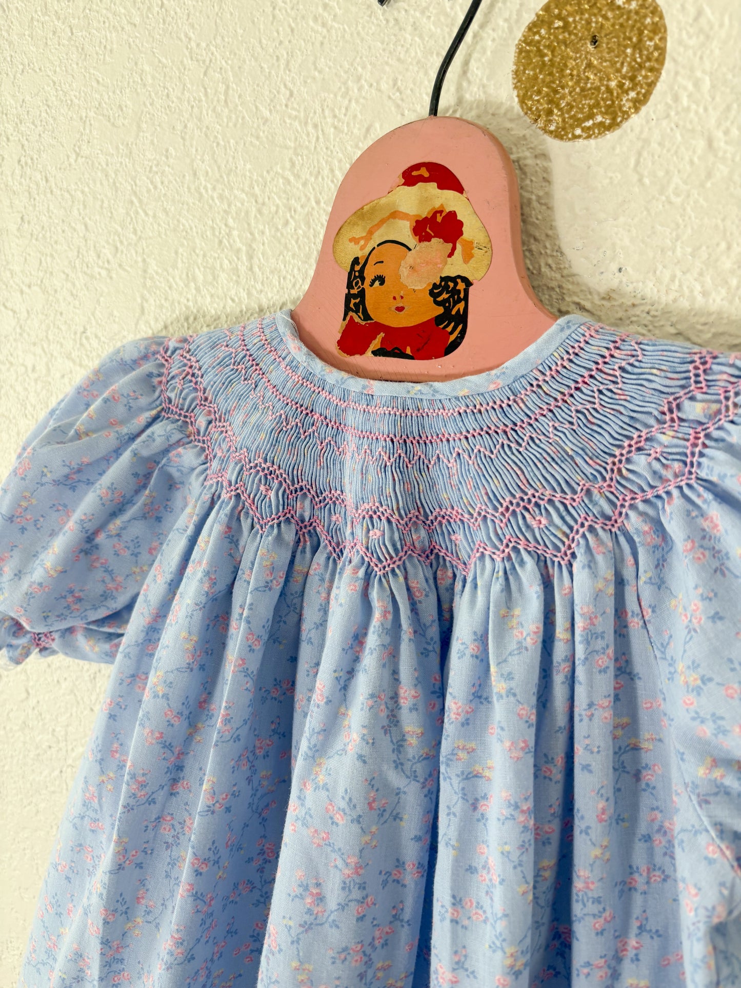 Homemade vintage smocked dainty floral baby dress.