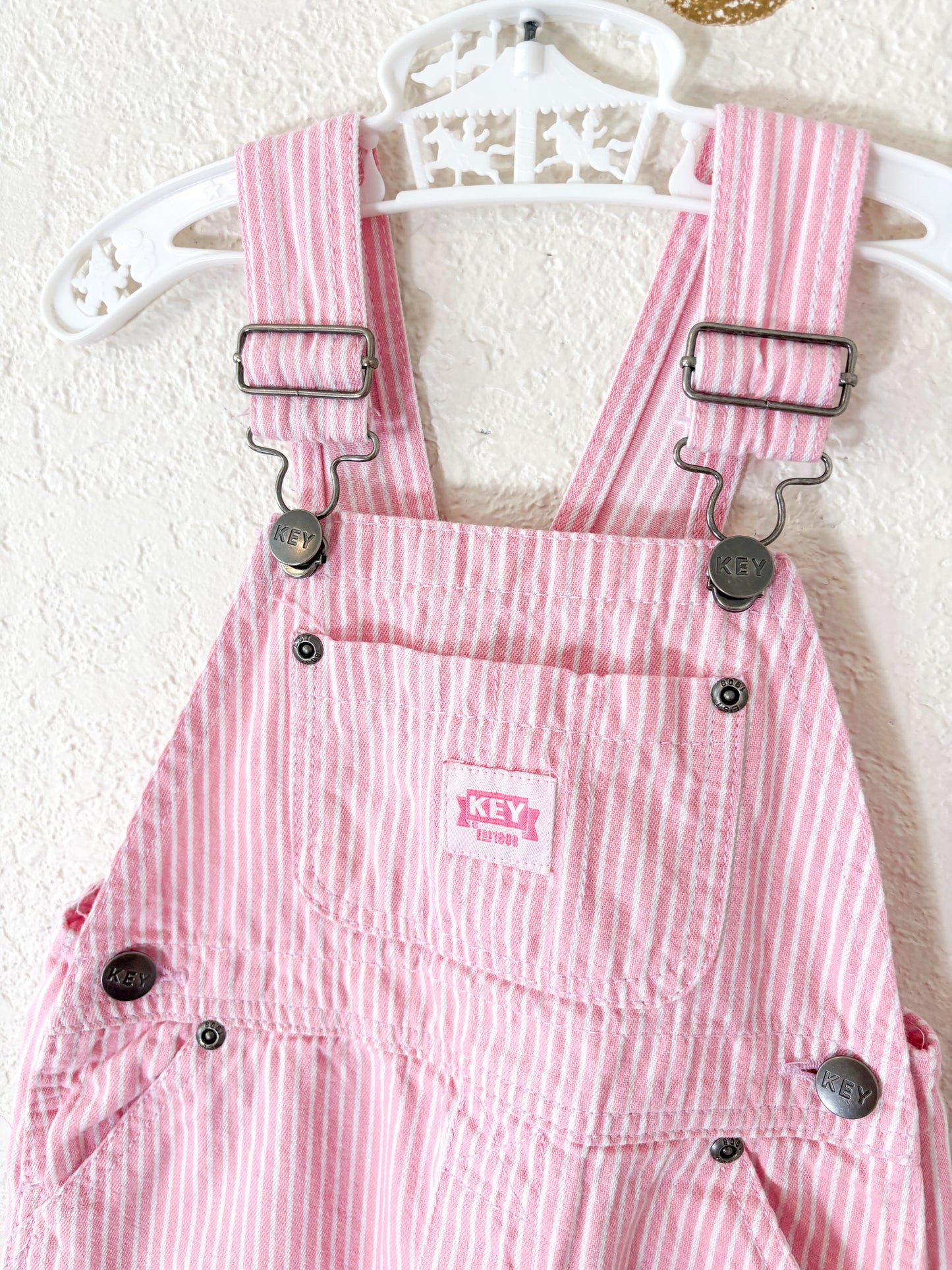 Modern Key striped toddler overalls.