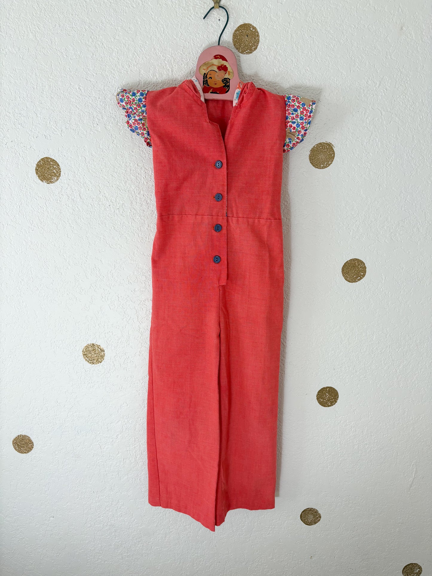 Vintage Buttercup romper w/floral trims.