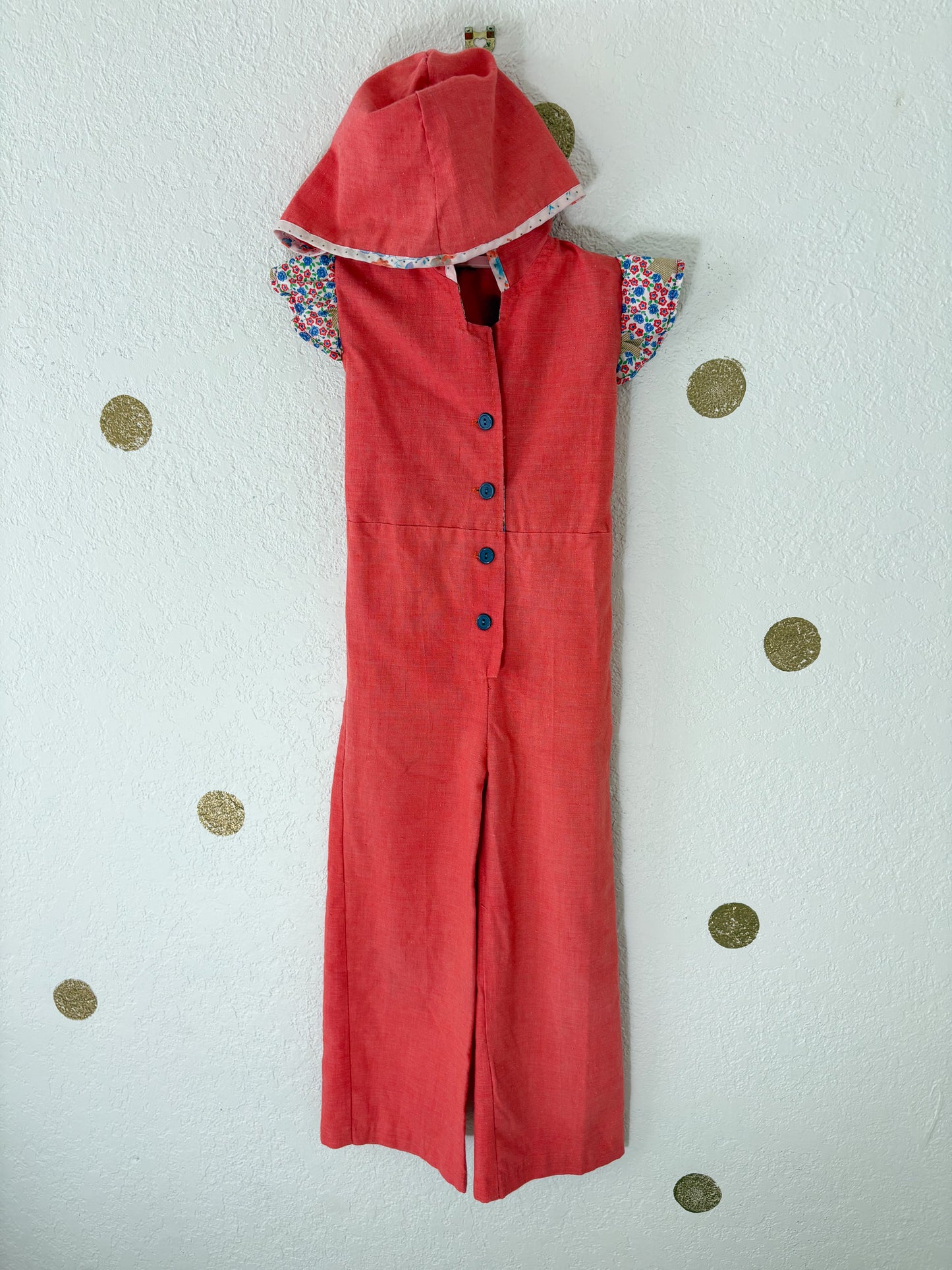 Vintage Buttercup romper w/floral trims.