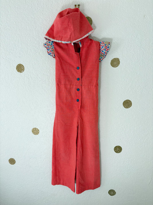 Vintage Buttercup romper w/floral trims.