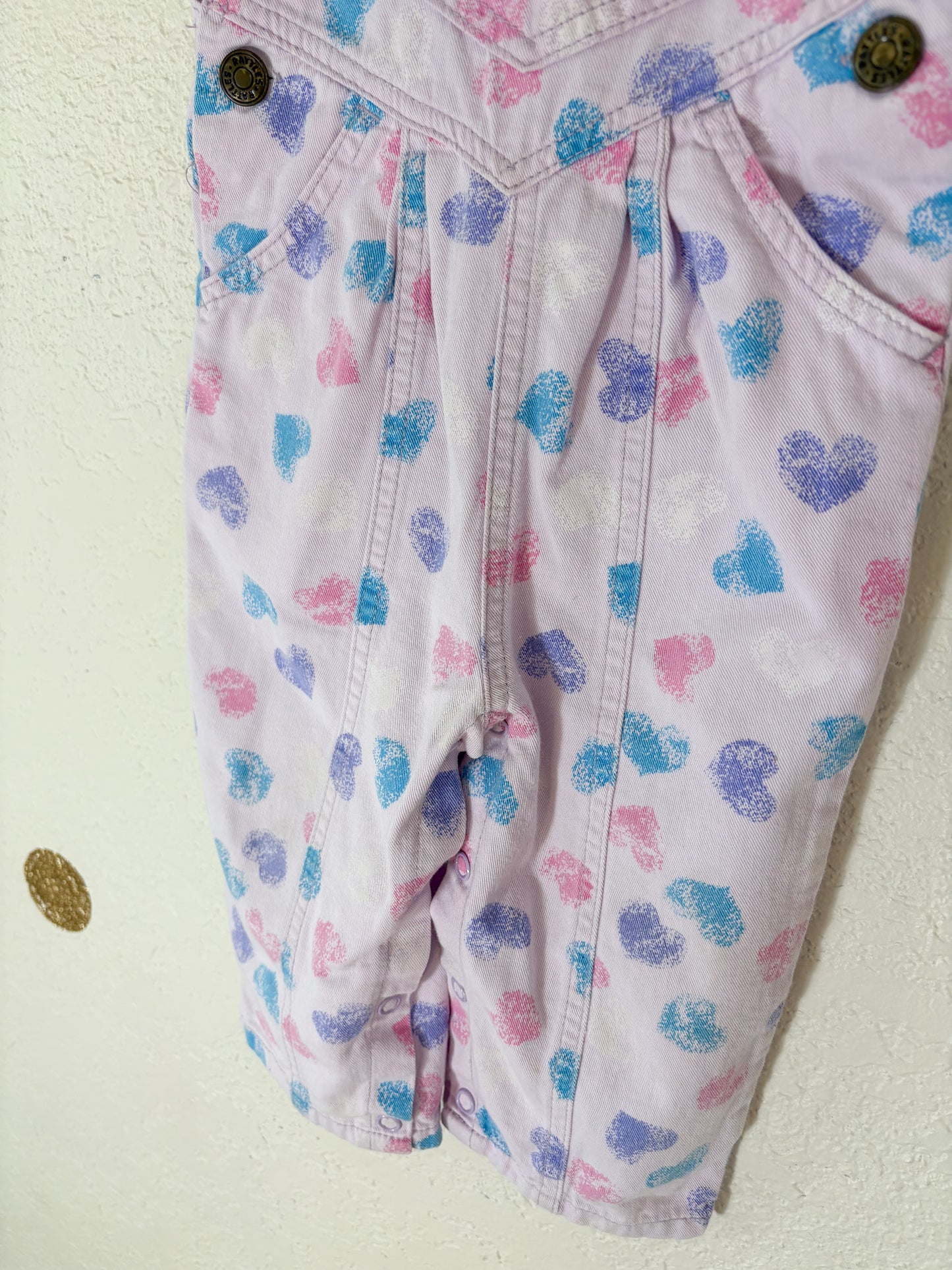 Vintage Rattle AOP baby overalls.